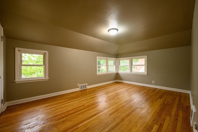 3776 S 16th St, Milwaukee, WI 53221 - empty room featuring light wood-style flooring, baseboards, and vaulted ceiling