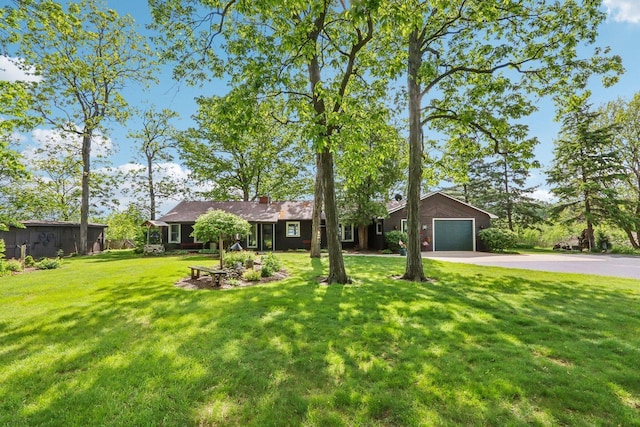 950 N Dousman Rd, Summit, WI 53066 - ranch-style home featuring driveway, a front yard, and an attached garage