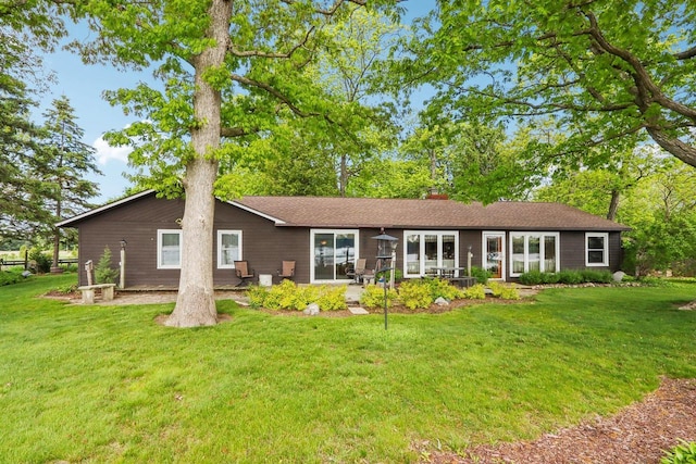 950 N Dousman Rd, Summit, WI 53066 - back of house featuring a yard, a chimney, and a patio area