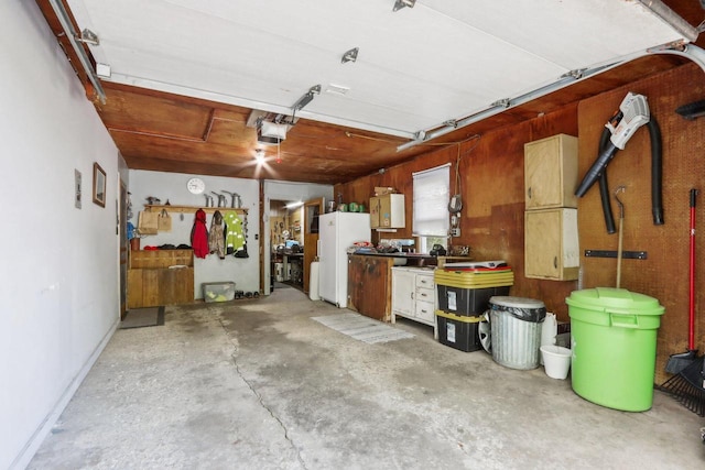 950 N Dousman Rd, Summit, WI 53066 - garage featuring freestanding refrigerator and a garage door opener