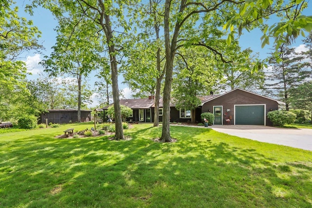 950 N Dousman Rd, Summit, WI 53066 - ranch-style home featuring concrete driveway, a garage, and a front yard