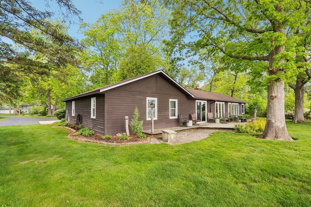 950 N Dousman Rd, Summit, WI 53066 - back of house featuring a lawn