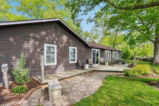 950 N Dousman Rd, Summit, WI 53066 - rear view of house featuring a wooden deck, a lawn, and a chimney