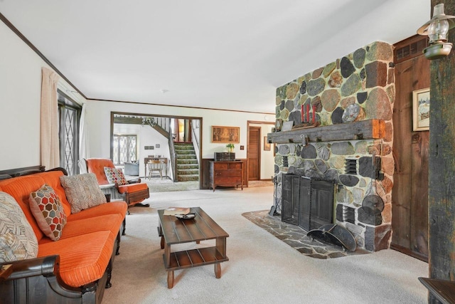 954 N Dousman Rd, Summit, WI 53066 - living room with carpet flooring, stairway, a stone fireplace, and crown molding