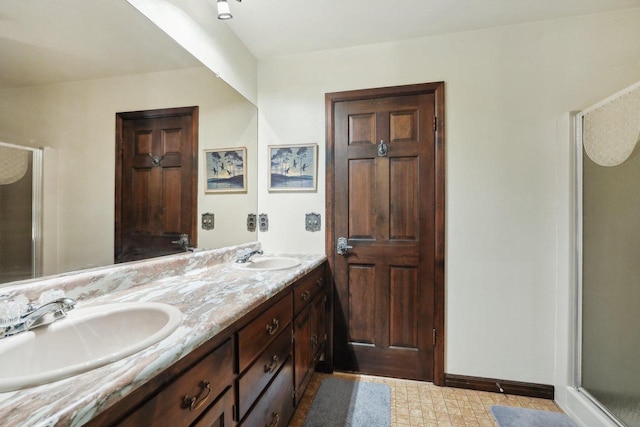 954 N Dousman Rd, Summit, WI 53066 - full bath featuring a shower stall, double vanity, and baseboards