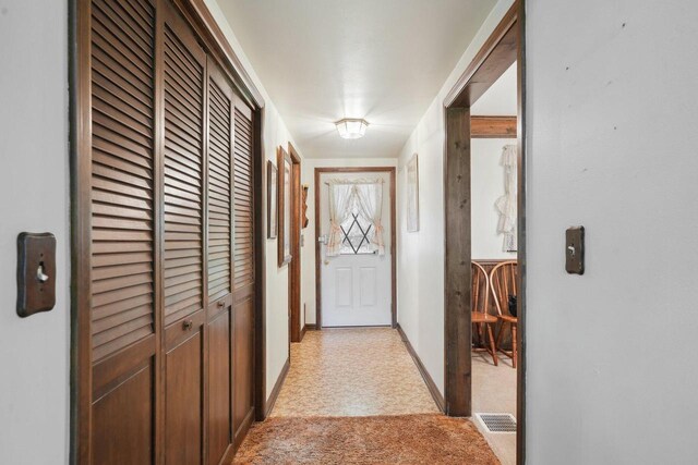 954 N Dousman Rd, Summit, WI 53066 - entryway featuring baseboards and light carpet