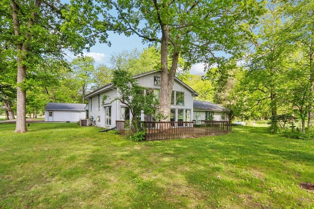 954 N Dousman Rd, Summit, WI 53066 - view of property exterior with a deck, a lawn, and central AC