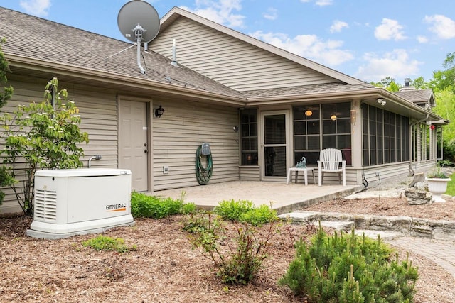 N4653 Thompson Rd, Shiocton, WI 54170 - back of property featuring a patio area, a sunroom, and a shingled roof