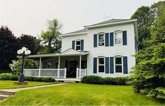 632 E 2nd St, New Richmond, WI 54017 - view of front of home featuring a porch and a front yard