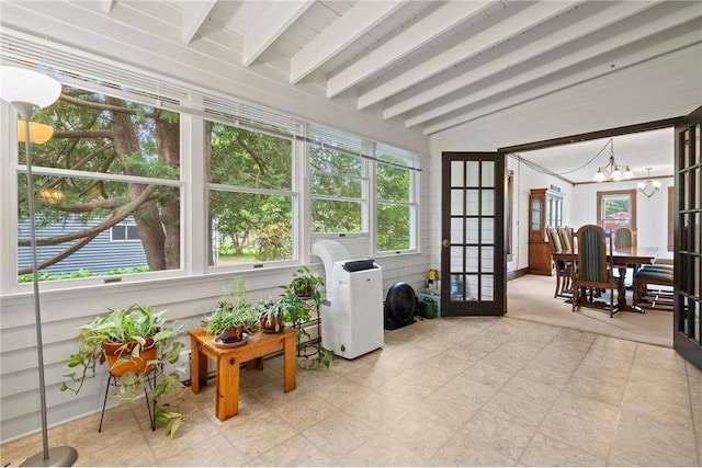 632 E 2nd St, New Richmond, WI 54017 - sunroom featuring french doors and a chandelier