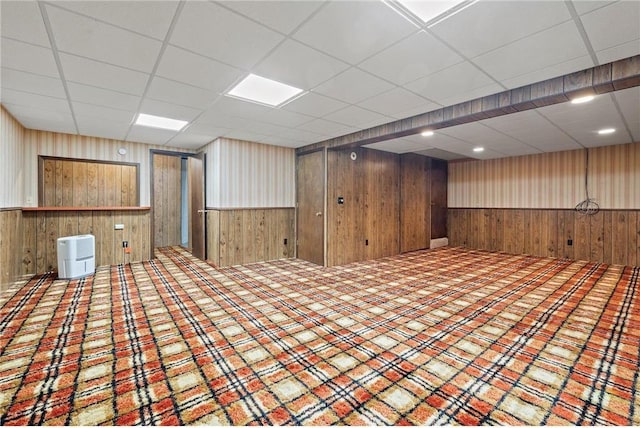 632 E 2nd St, New Richmond, WI 54017 - spare room with wood walls, wainscoting, and a drop ceiling