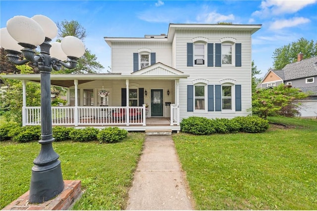 632 E 2nd St, New Richmond, WI 54017 - view of front of home featuring a porch and a front lawn