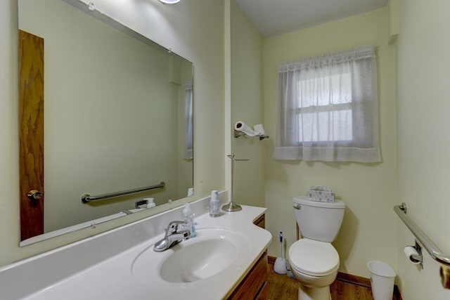 4705 Agate Ln, Madison, WI 53714 - bathroom with toilet, vanity, and wood finished floors