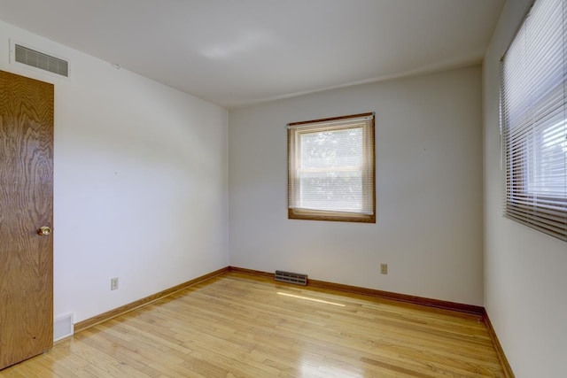4705 Agate Ln, Madison, WI 53714 - empty room featuring plenty of natural light, light wood finished floors, and baseboards
