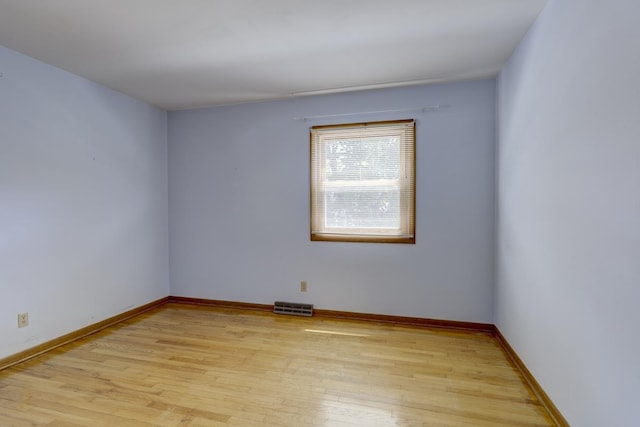 4705 Agate Ln, Madison, WI 53714 - spare room with light wood-style floors and baseboards