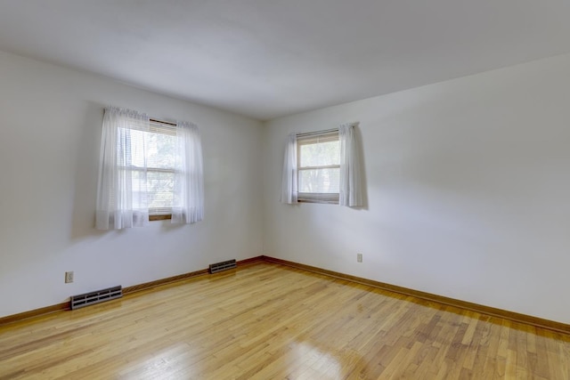 4705 Agate Ln, Madison, WI 53714 - empty room with light wood-style flooring and baseboards