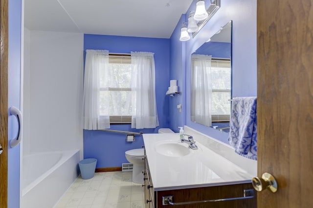 4705 Agate Ln, Madison, WI 53714 - bathroom with plenty of natural light, vanity, toilet, and a bathtub