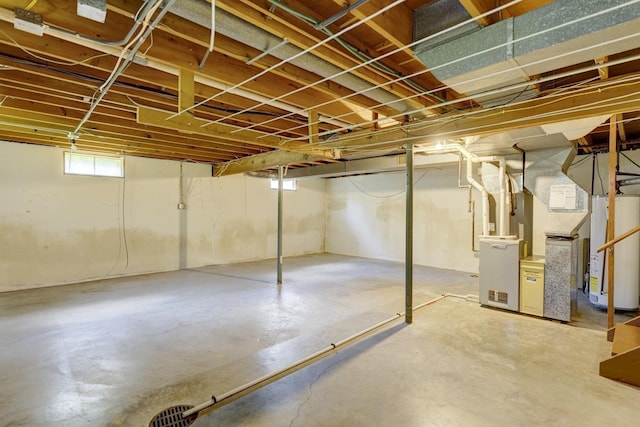 4705 Agate Ln, Madison, WI 53714 - below grade area featuring water heater, heating unit, and stairs