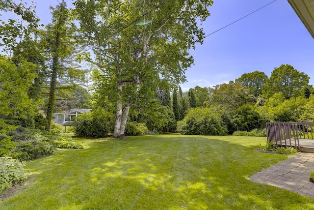 4705 Agate Ln, Madison, WI 53714 - view of grassy yard with a wooden deck