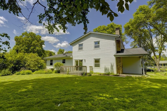 4705 Agate Ln, Madison, WI 53714 - back of property featuring a chimney, a yard, and a deck