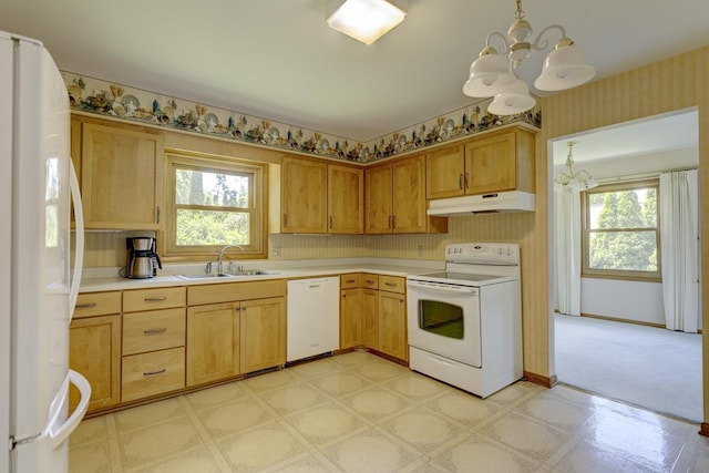 4705 Agate Ln, Madison, WI 53714 - kitchen with white appliances, under cabinet range hood, a chandelier, a sink, and light floors