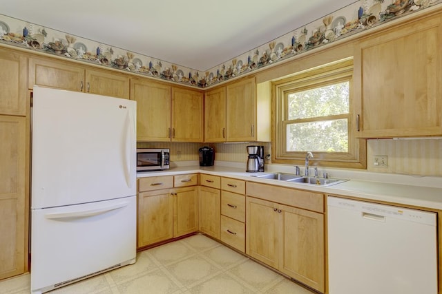 4705 Agate Ln, Madison, WI 53714 - kitchen featuring white appliances, a sink, light floors, and light countertops