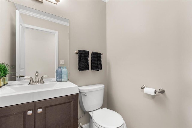 W308N5583 Windrise Cir, Hartland, WI 53029 - bathroom featuring toilet, vanity, and baseboards