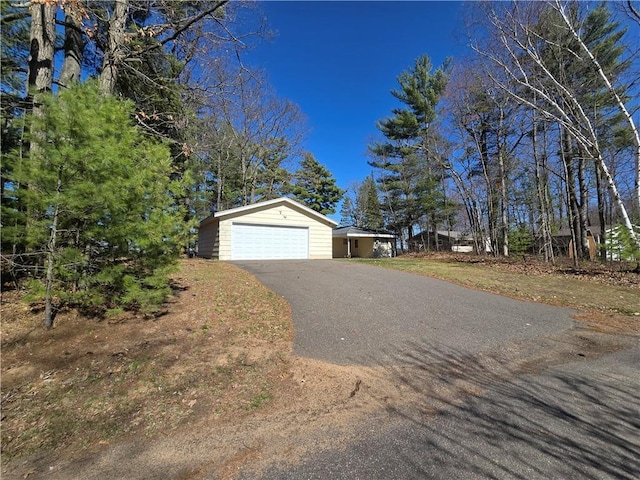 5922 W Shore Ln, Stone Lake, WI 54876 - view of front facade featuring a detached garage