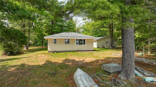 5922 W Shore Ln, Stone Lake, WI 54876 - rear view of property featuring crawl space and a lawn