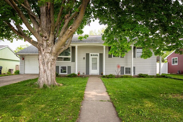 2921 Glendale Ave, La Crosse, WI 54601 - view of front facade with a garage, a front lawn, and concrete driveway