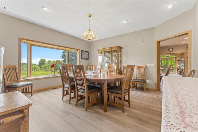 1115 S Trappers Xing, Hugo, MN 55038 - dining room featuring a chandelier, light wood-type flooring, baseboards, and recessed lighting