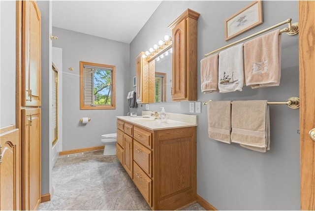 1115 S Trappers Xing, Hugo, MN 55038 - full bathroom with vanity, toilet, baseboards, and enclosed tub / shower combo