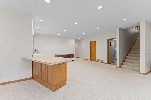 1115 S Trappers Xing, Hugo, MN 55038 - bar featuring light colored carpet, baseboards, recessed lighting, stairs, and a sink
