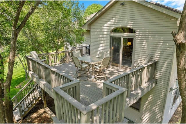 1115 S Trappers Xing, Hugo, MN 55038 - wooden deck with outdoor dining area and stairs