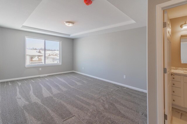 6308 Perch Dr, Weston, WI 54476 - carpeted spare room with a tray ceiling and baseboards