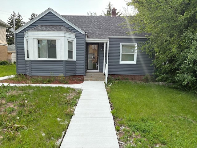 2825 N 62nd St, Milwaukee, WI 53210 - view of front of home with a chimney, roof with shingles, and a front lawn
