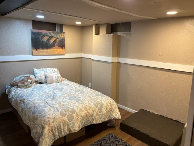 2825 N 62nd St, Milwaukee, WI 53210 - bedroom with a textured wall, wood finished floors, recessed lighting, and baseboards