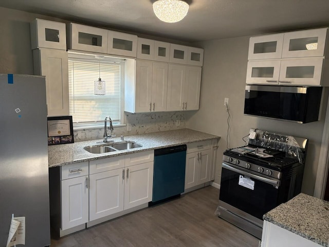 2825 N 62nd St, Milwaukee, WI 53210 - kitchen featuring stainless steel appliances, a sink, white cabinets, and dark wood finished floors