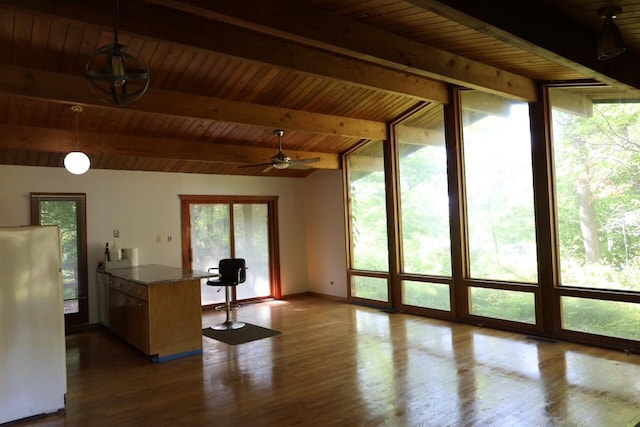 N2335 Main Rd, Lake Geneva, WI 53147 - kitchen featuring wood ceiling with exposed beams, freestanding refrigerator, wood finished floors, hanging light fixtures, and ceiling fan