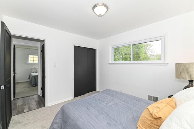 4155 N 67th St, Milwaukee, WI 53216 - bedroom with multiple windows, carpet floors, baseboards, and a closet