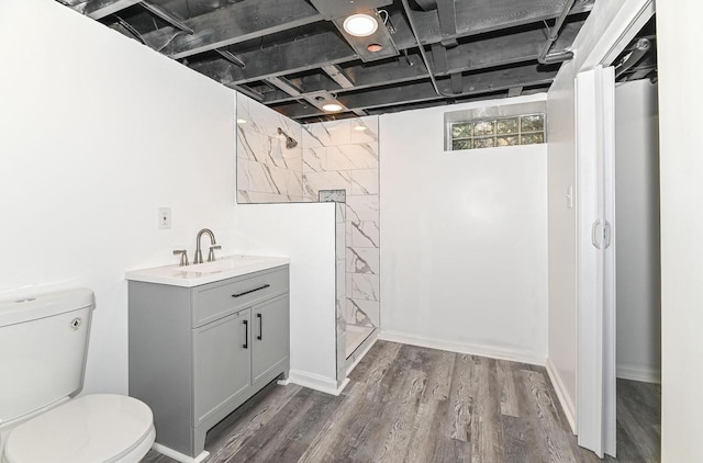4155 N 67th St, Milwaukee, WI 53216 - full bath with tiled shower, toilet, wood finished floors, and vanity