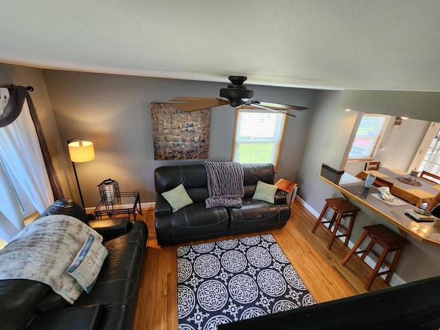 3617 S 80th St, Milwaukee, WI 53220 - living room featuring plenty of natural light, a ceiling fan, wood finished floors, and baseboards