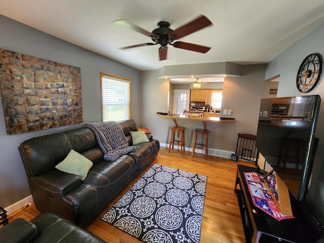 3617 S 80th St, Milwaukee, WI 53220 - living area with a ceiling fan, light wood finished floors, and baseboards