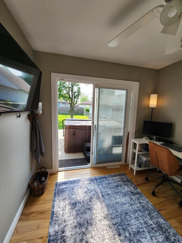 3617 S 80th St, Milwaukee, WI 53220 - doorway featuring wood finished floors, ceiling fan, baseboards, and an office area