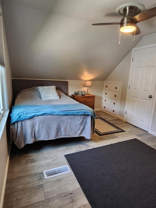 3617 S 80th St, Milwaukee, WI 53220 - bedroom with lofted ceiling, wood finished floors, baseboards, and ceiling fan