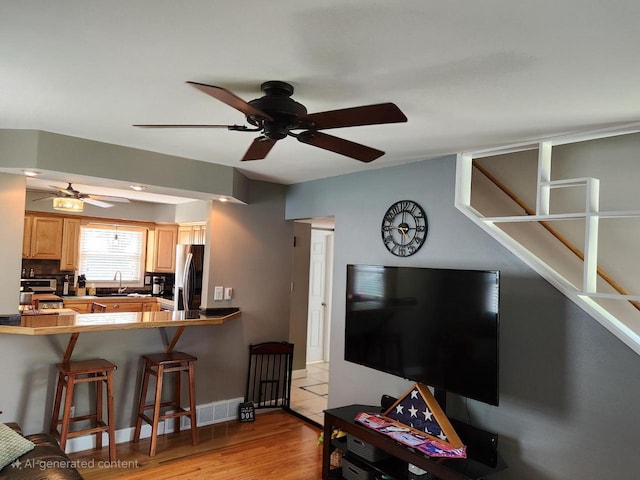 3617 S 80th St, Milwaukee, WI 53220 - living area with ceiling fan and light wood-style floors