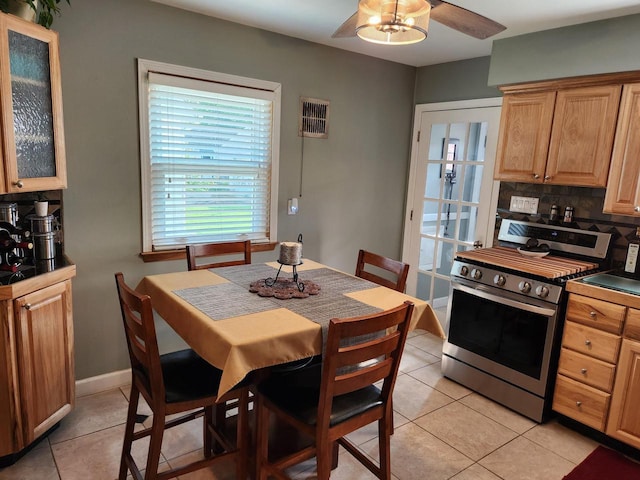 3617 S 80th St, Milwaukee, WI 53220 - dining area with light tile patterned floors, ceiling fan, and baseboards