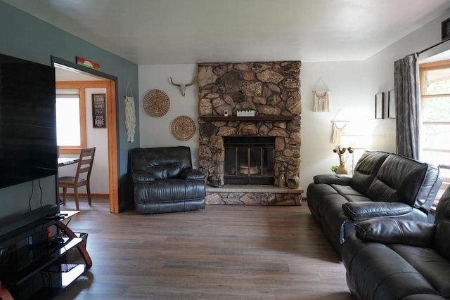 3867 S Massachusetts Ave, Milwaukee, WI 53220 - living area featuring wood finished floors and a stone fireplace