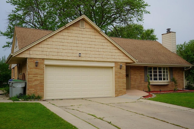 3867 S Massachusetts Ave, Milwaukee, WI 53220 - view of front of property with brick siding, a garage, concrete driveway, and a chimney