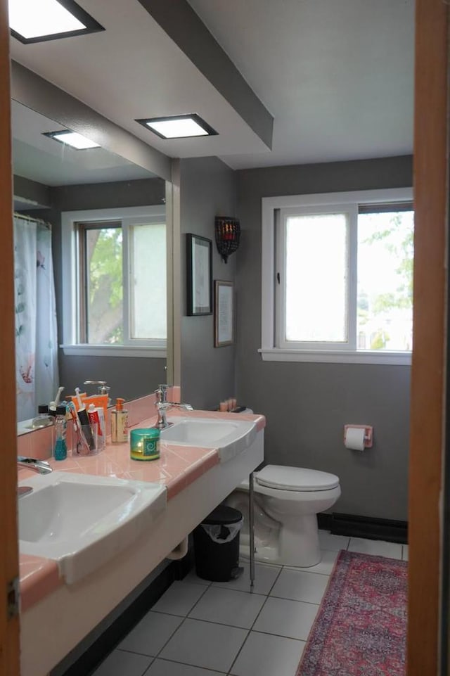 3867 S Massachusetts Ave, Milwaukee, WI 53220 - full bath with tile patterned flooring, healthy amount of natural light, toilet, and double vanity